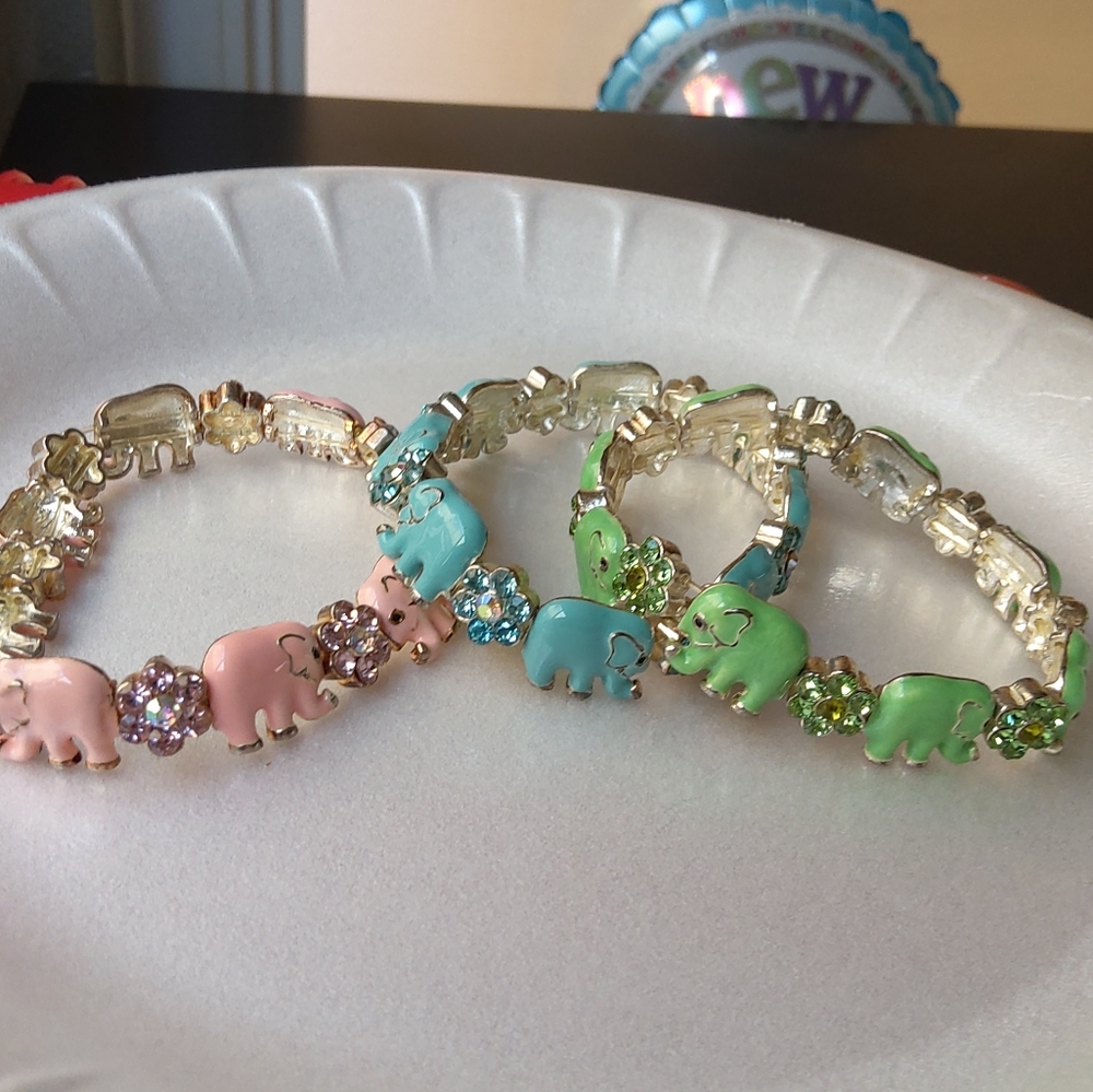 Bundle of 3 bracelets elefant and flower.